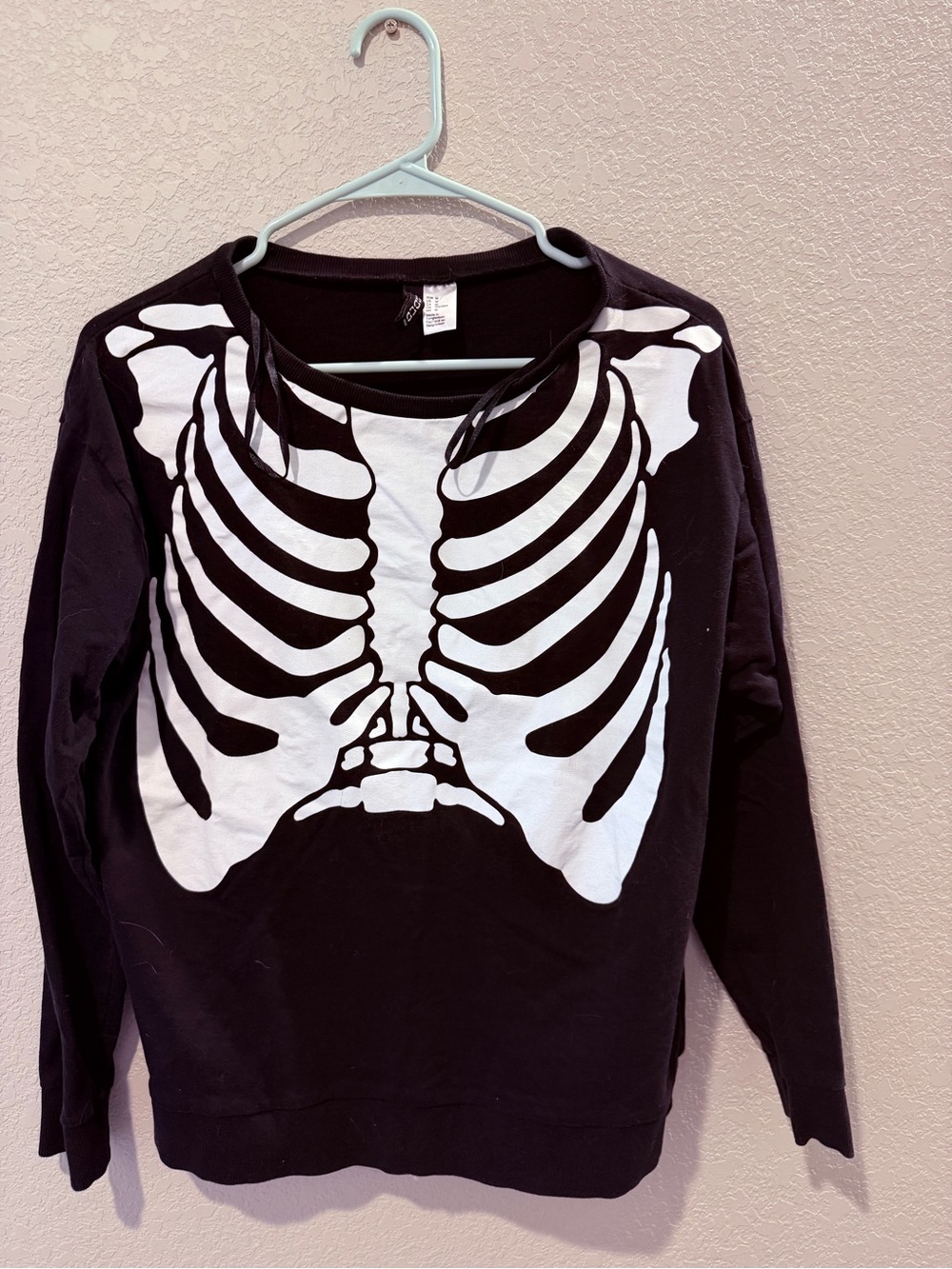 Divided Black Pullover Sweatshirt with White Ribcage Graphic